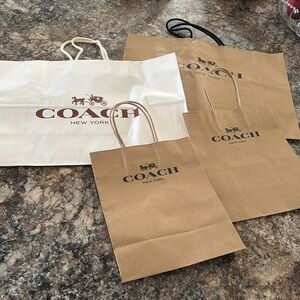 Coach set of 4 paper shopping bags use as gift bags for your coach items
